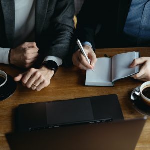 Two young businessman having a successful meeting at restaurant.